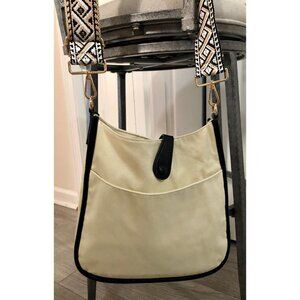 Ahdorned cream colored fabric canvas messenger crossbody black faux leather trim
